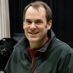 portrait of Jerry LaBuy wearing a dark zip up sweater